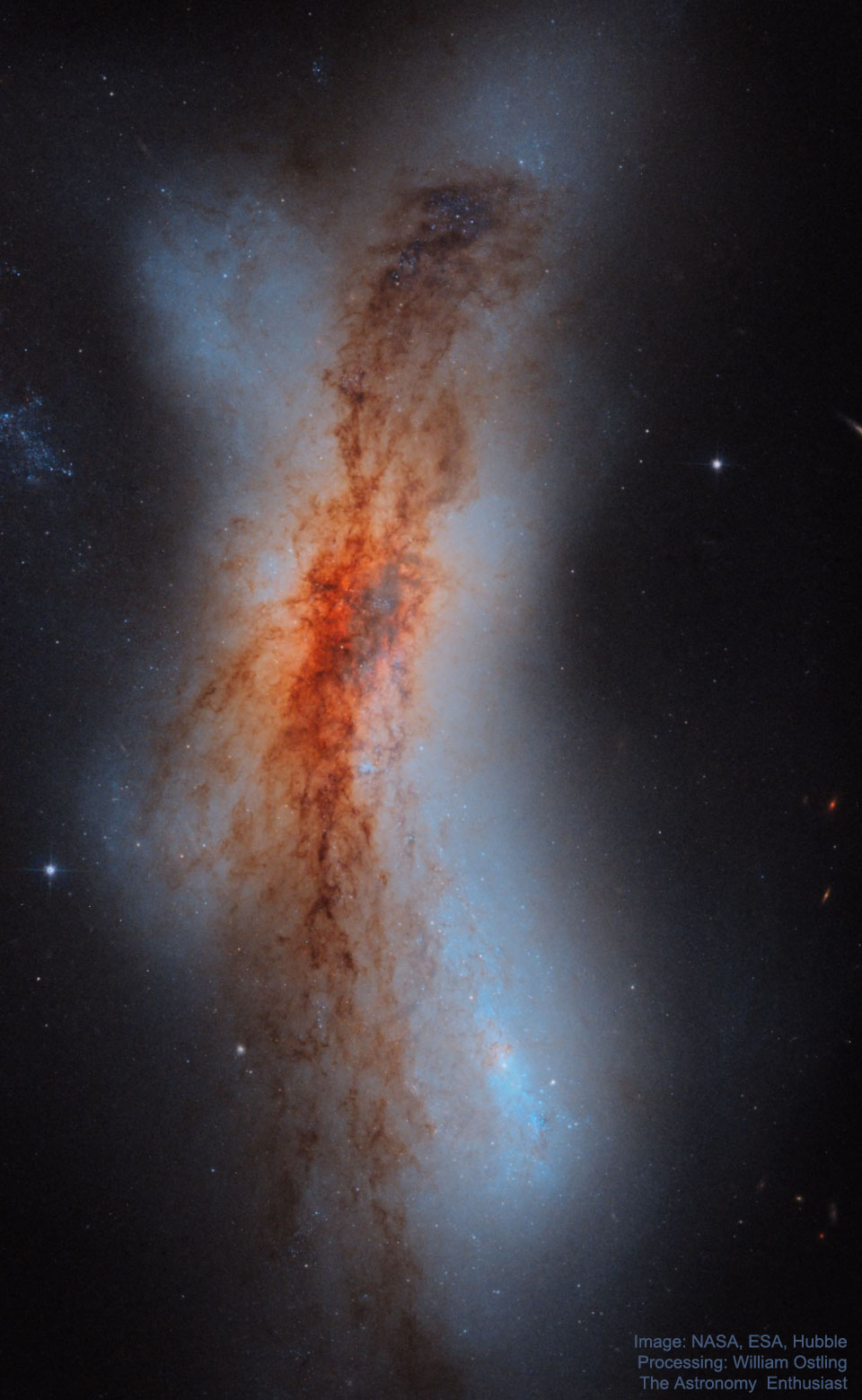 图为NGC 520的碰撞星系，由NASA和ESA的哈勃太空望远镜拍摄。有关更多详细信息，请参阅说明。 