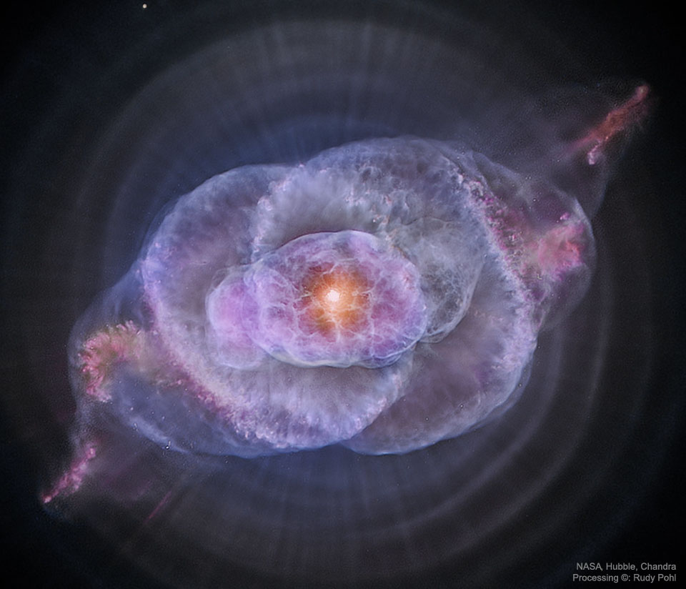 图片显示了猫眼星云的深层图像，其中包含来自哈勃和钱德拉太空望远镜的图像数据。有关更多详细信息，请参阅说明。